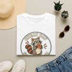 Cheat Day Support Club raccoon eating a donut graphic T-shirt product mockup